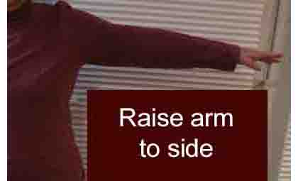 photo shows woman with arm extended to her side, shoulder-high